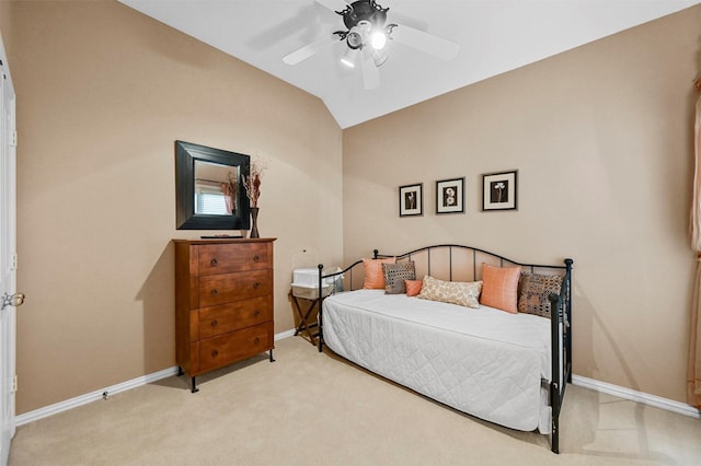 carpeted bedroom with vaulted ceiling and ceiling fan