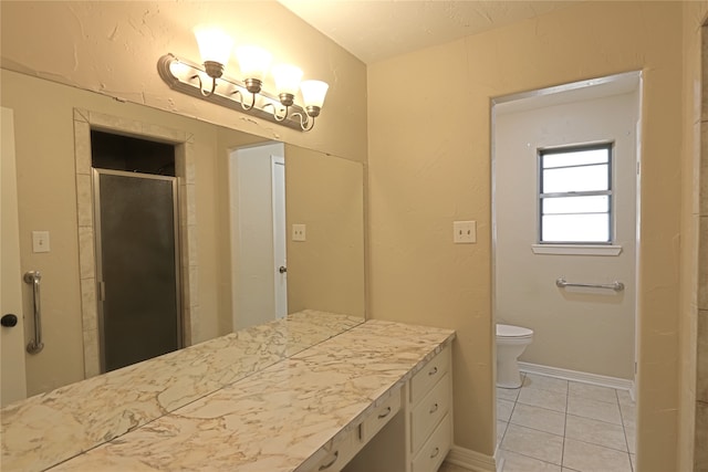 bathroom with an enclosed shower, vanity, tile patterned floors, and toilet