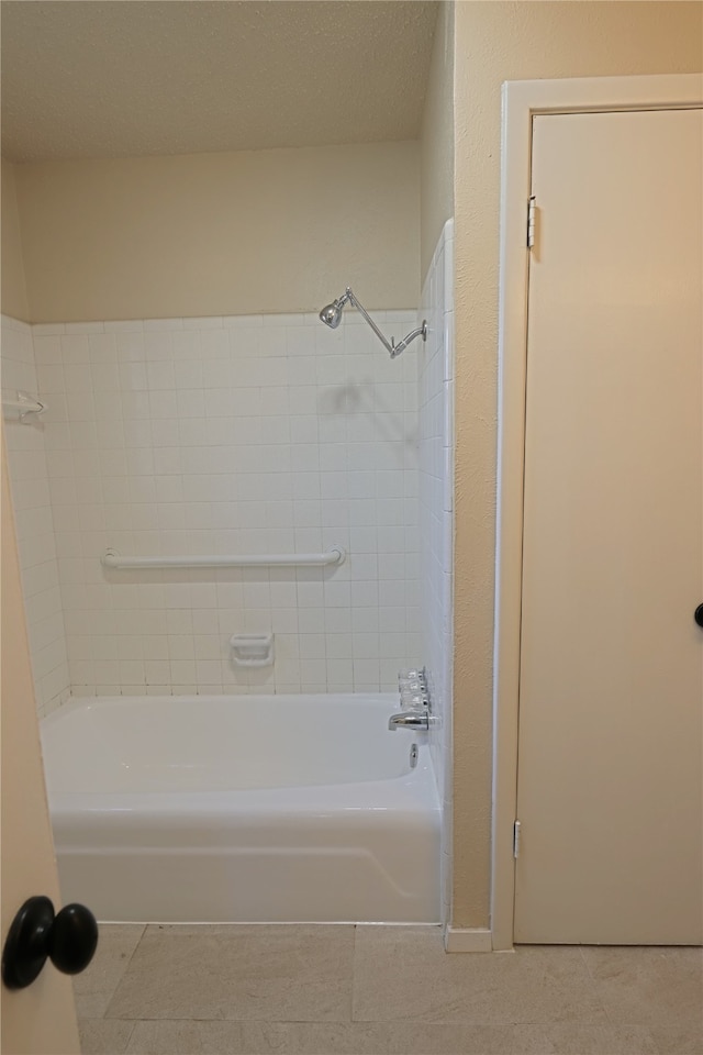 bathroom with bathtub / shower combination and tile patterned floors