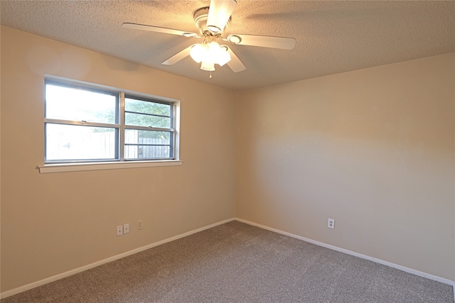 unfurnished room with a textured ceiling, ceiling fan, and carpet