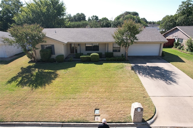 ranch-style house with a front lawn and a garage