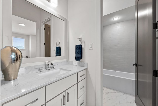 bathroom featuring marble finish floor, shower / washtub combination, vanity, and recessed lighting