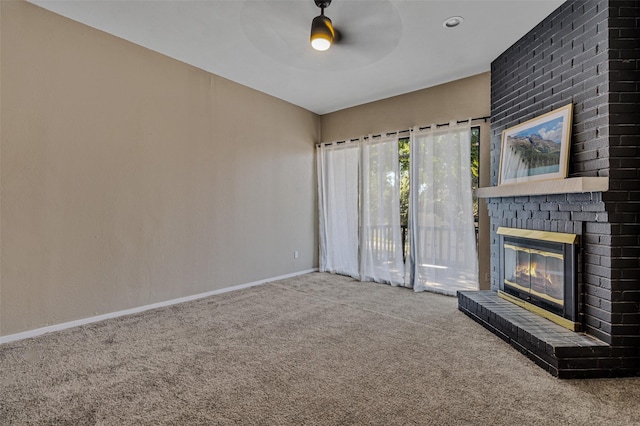 unfurnished living room with carpet floors, ceiling fan, and a fireplace