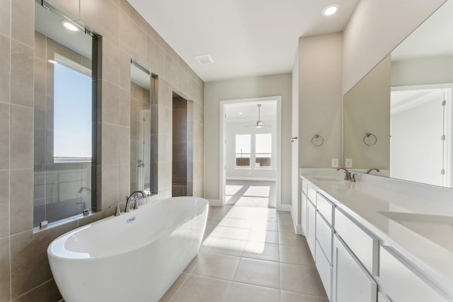 bathroom featuring ceiling fan, tile patterned flooring, vanity, and shower with separate bathtub