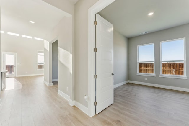 hall with light hardwood / wood-style floors