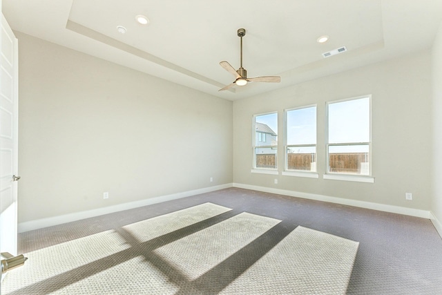 9832 Palermo Dr, Mesquite, TX 75126 - spare room featuring carpet flooring, baseboards, ceiling fan, recessed lighting, and a tray ceiling