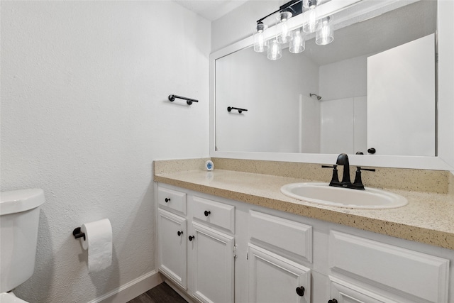 bathroom with vanity and toilet