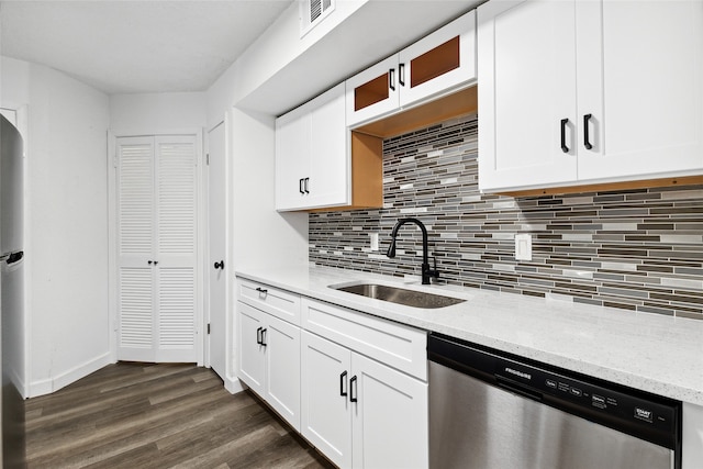 kitchen featuring light stone counters, white cabinets, sink, stainless steel appliances, and dark hardwood / wood-style flooring