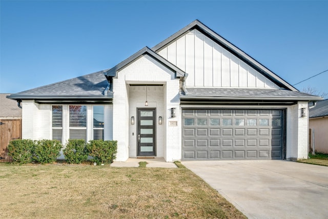 modern farmhouse style home with a front yard and a garage