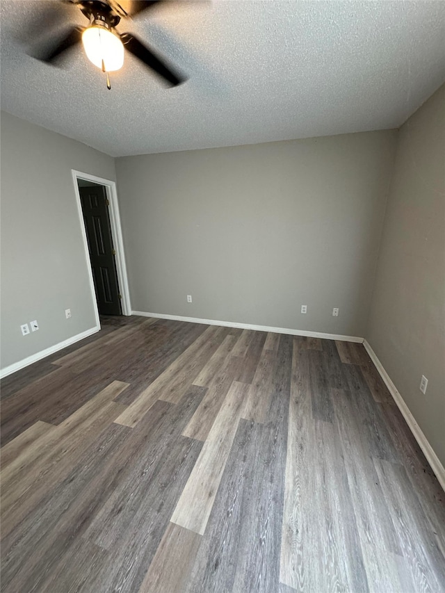 spare room featuring wood-type flooring, a textured ceiling, and ceiling fan