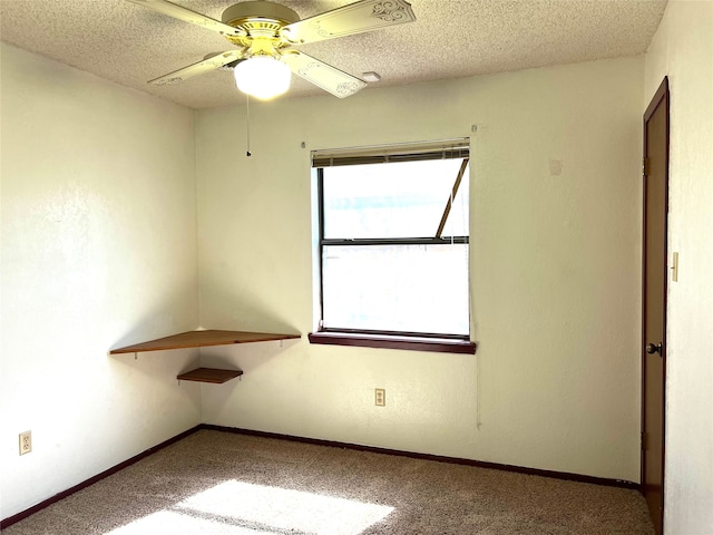 unfurnished room featuring a textured ceiling, ceiling fan, and carpet flooring