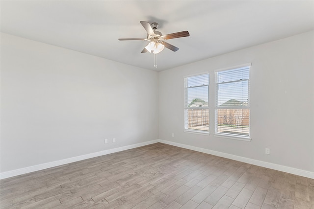 unfurnished room with ceiling fan and light hardwood / wood-style flooring