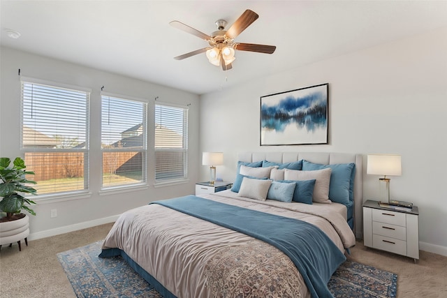 bedroom with light colored carpet and ceiling fan