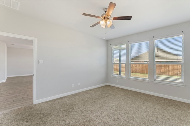 unfurnished room with hardwood / wood-style floors and ceiling fan