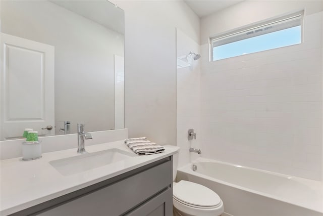 full bathroom featuring vanity, toilet, and tiled shower / bath