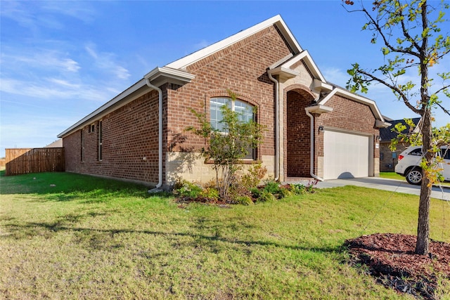 view of front facade with a garage and a front lawn