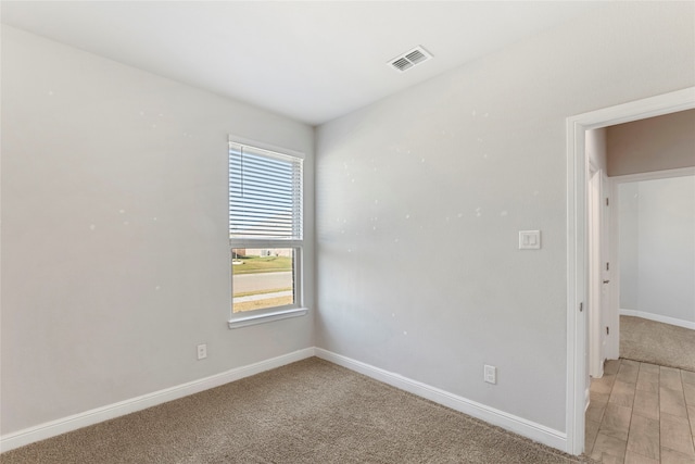 view of carpeted spare room