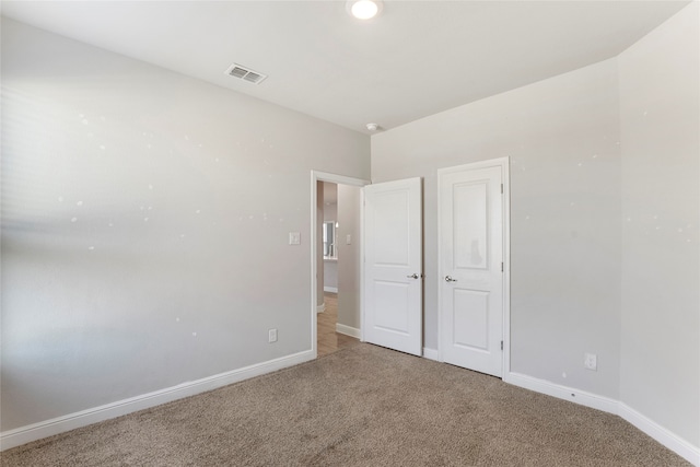 unfurnished bedroom with carpet floors