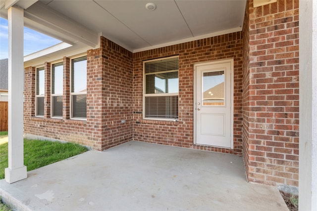 property entrance with a patio area