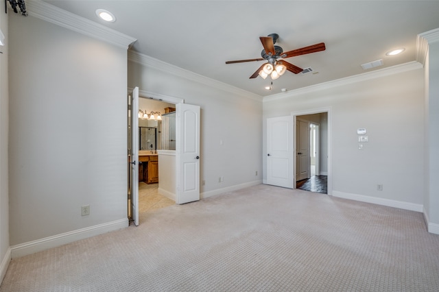 unfurnished bedroom featuring ceiling fan, ornamental molding, light carpet, and ensuite bathroom