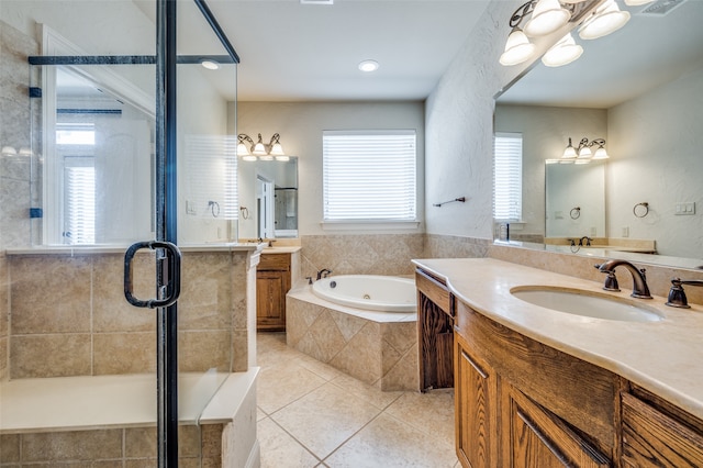 bathroom with separate shower and tub, tile patterned floors, and vanity