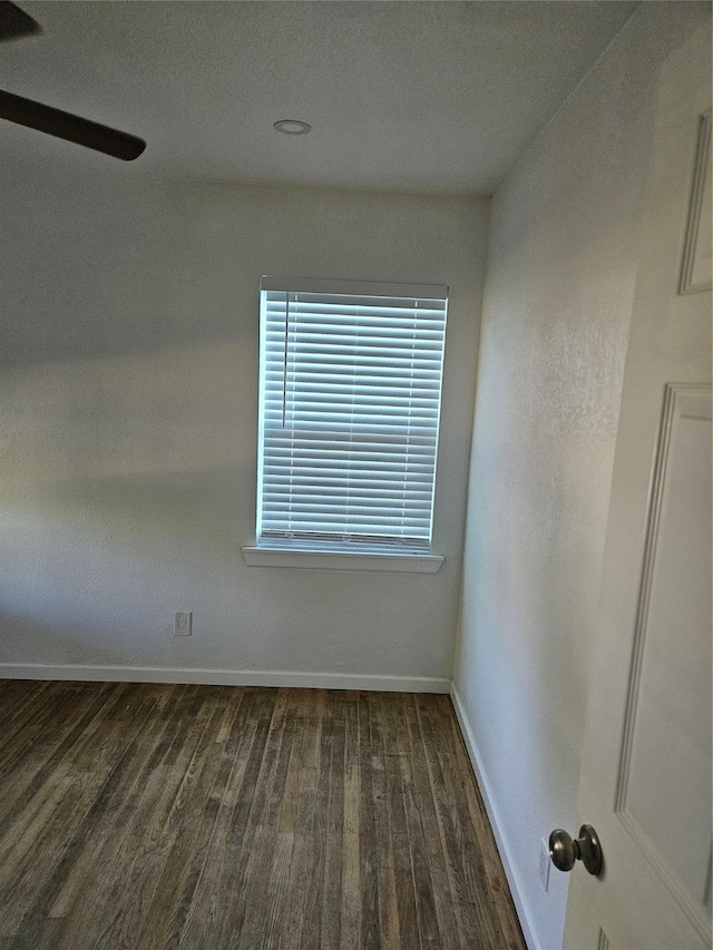 spare room with dark hardwood / wood-style floors