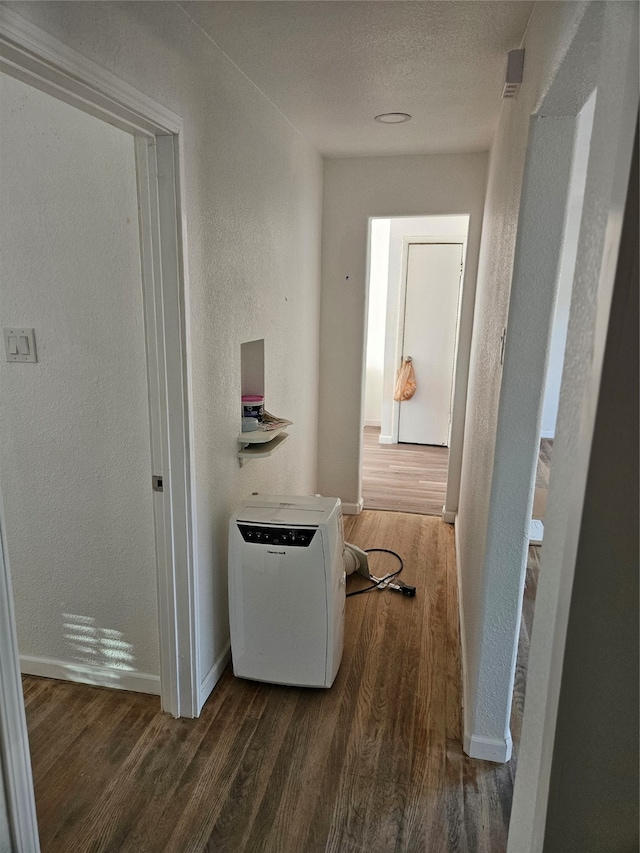 hall with dark wood-type flooring