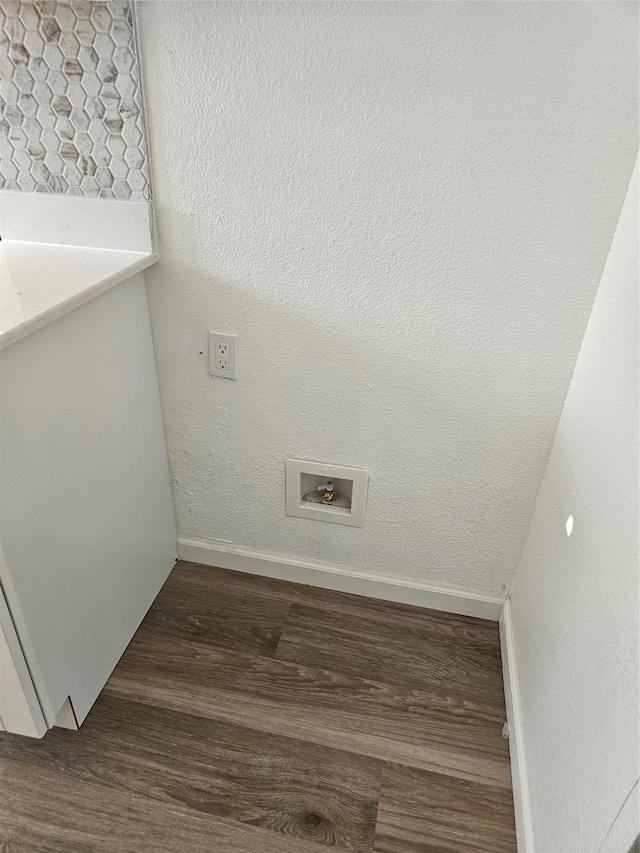 laundry room with dark wood-type flooring and washer hookup