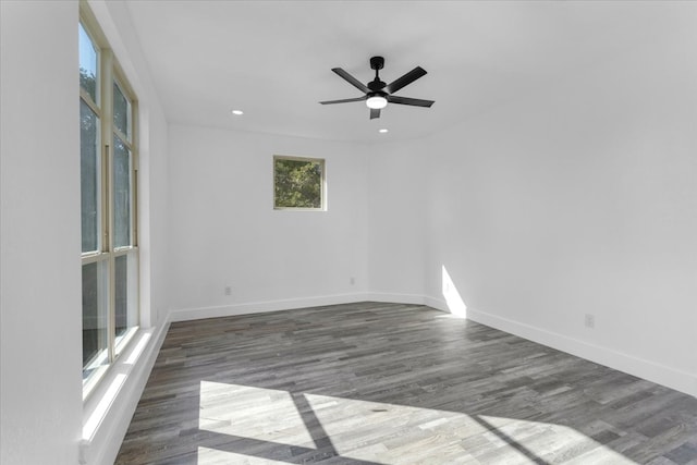 empty room featuring dark hardwood / wood-style floors and ceiling fan