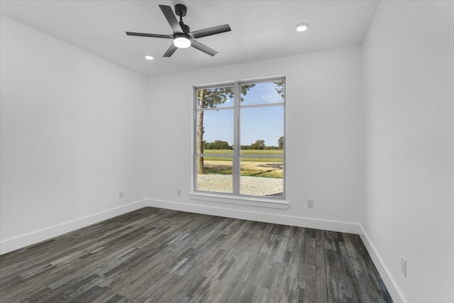 empty room featuring dark hardwood / wood-style floors and ceiling fan