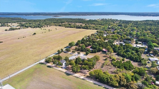 birds eye view of property with a rural view and a water view