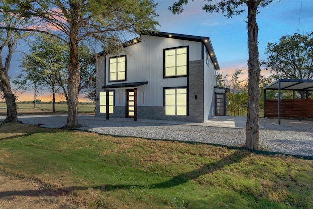 exterior space with a yard and a carport