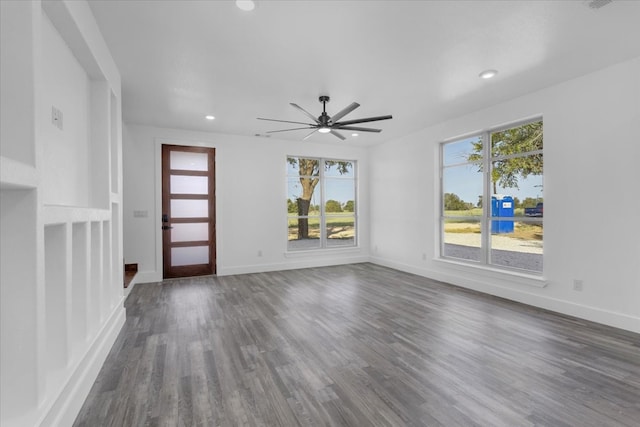 foyer entrance with dark hardwood / wood-style floors and ceiling fan