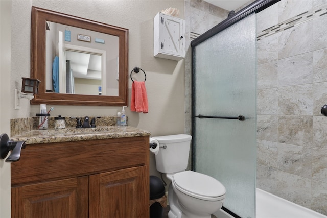 bathroom with vanity, toilet, and an enclosed shower