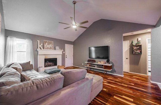 living room with ceiling fan, lofted ceiling, and dark hardwood / wood-style flooring