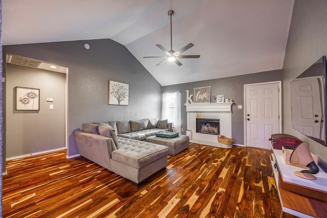 living room featuring ceiling fan, lofted ceiling, and dark hardwood / wood-style flooring