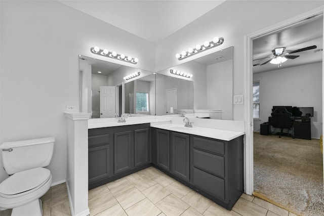 bathroom with ceiling fan, vanity, and toilet