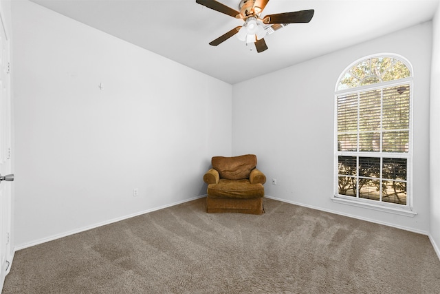 unfurnished room with ceiling fan and carpet flooring