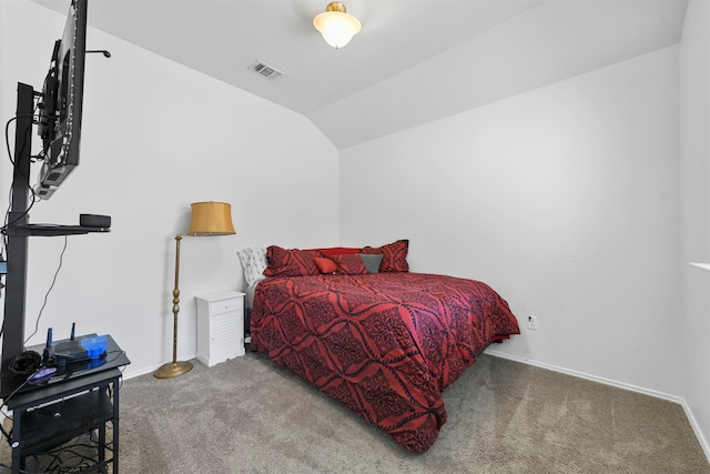 carpeted bedroom with vaulted ceiling