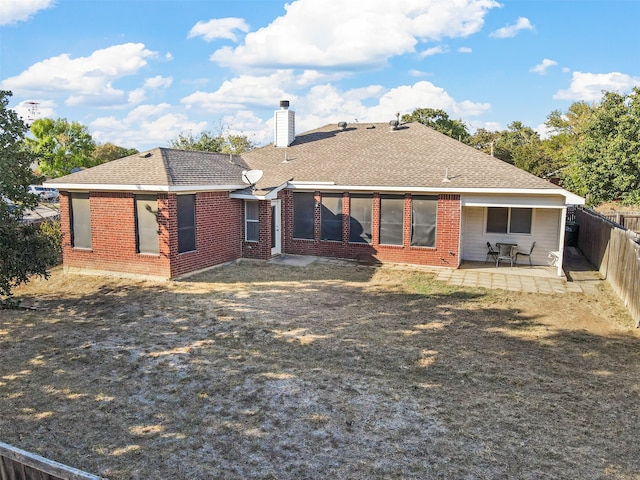 back of property featuring a patio