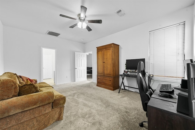 carpeted office with ceiling fan