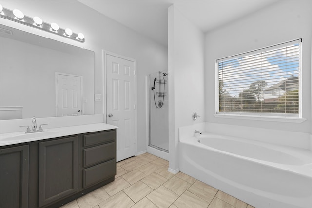 bathroom featuring separate shower and tub and vanity