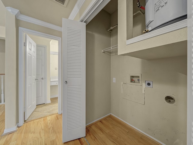 laundry area with washer hookup, crown molding, light wood-type flooring, and electric dryer hookup