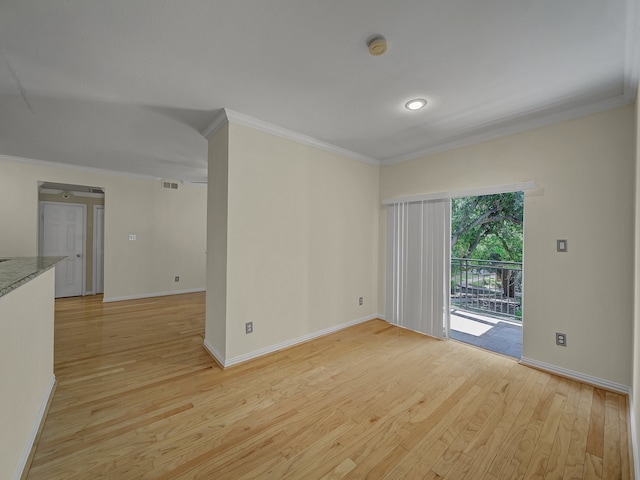 unfurnished room with light wood-type flooring and ornamental molding