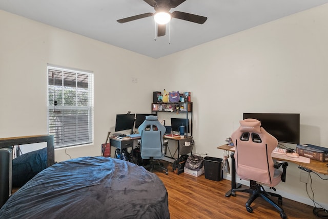 bedroom with hardwood / wood-style floors and ceiling fan