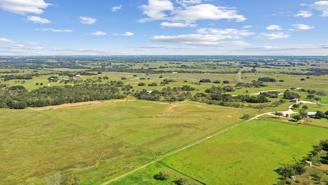 birds eye view of property with a rural view