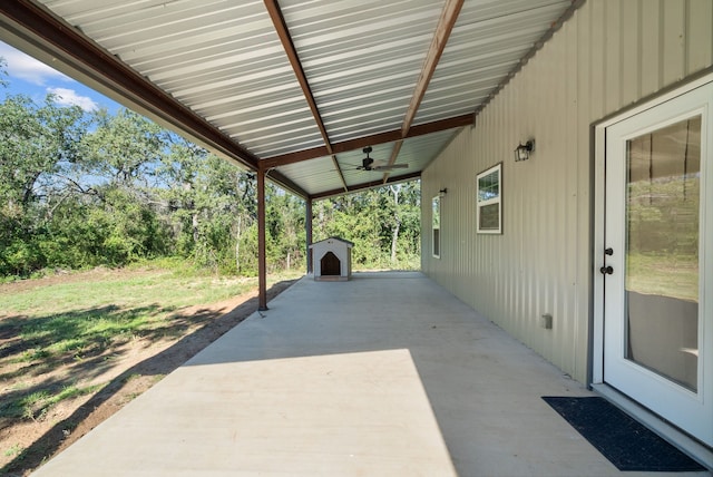 view of patio with a storage shed and ceiling fan