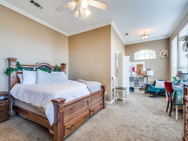 carpeted bedroom featuring ornamental molding and ceiling fan