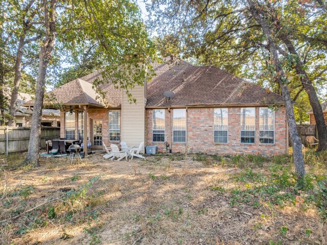 back of property featuring a patio area