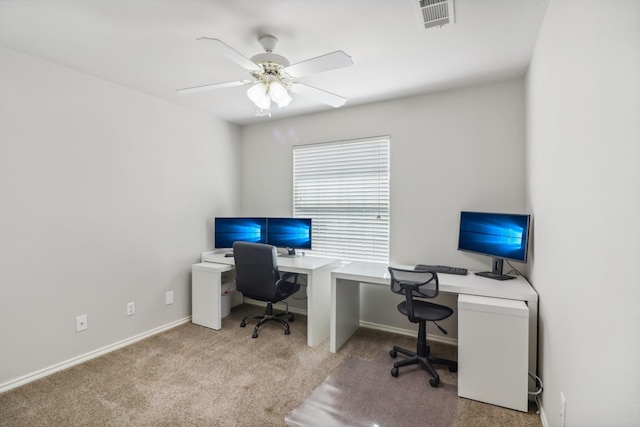 carpeted home office with baseboards, visible vents, and ceiling fan